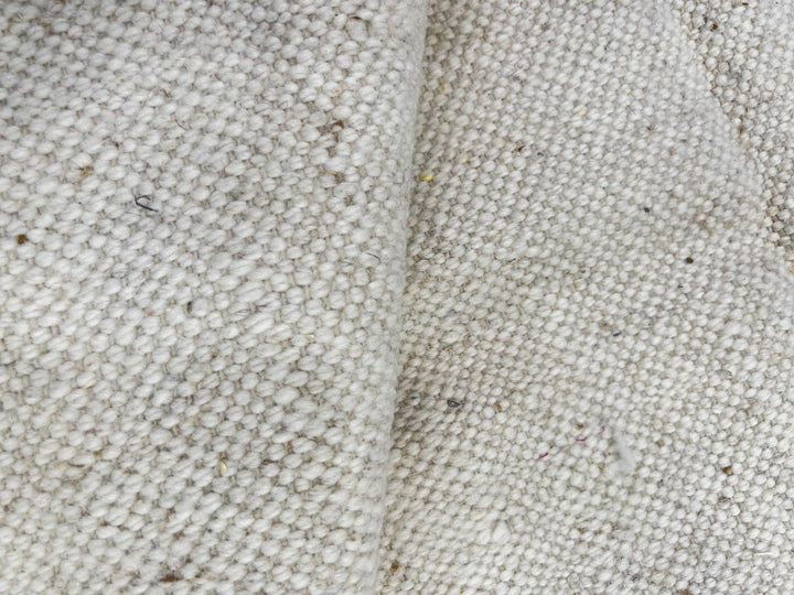 Turquoise and black Moroccan runner rug with abstract geometric pattern on ivory wool, handmade Berber design