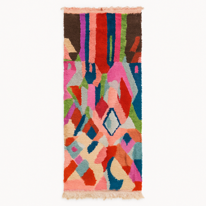 Handmade colorful Moroccan wool runner rug with abstract geometric pattern in red, blue, pink, and green tones