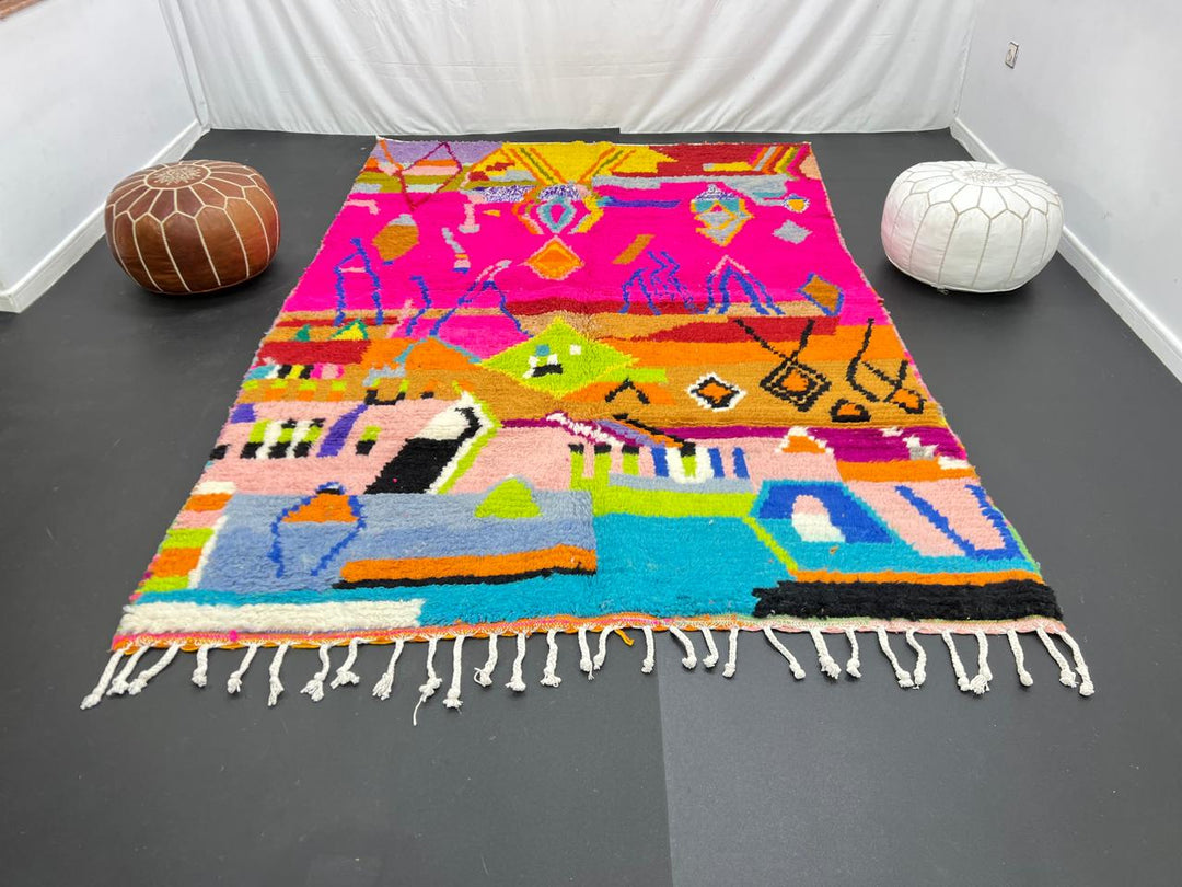Collector Moroccan wool rug with vibrant abstract Berber patterns on a magenta pink background