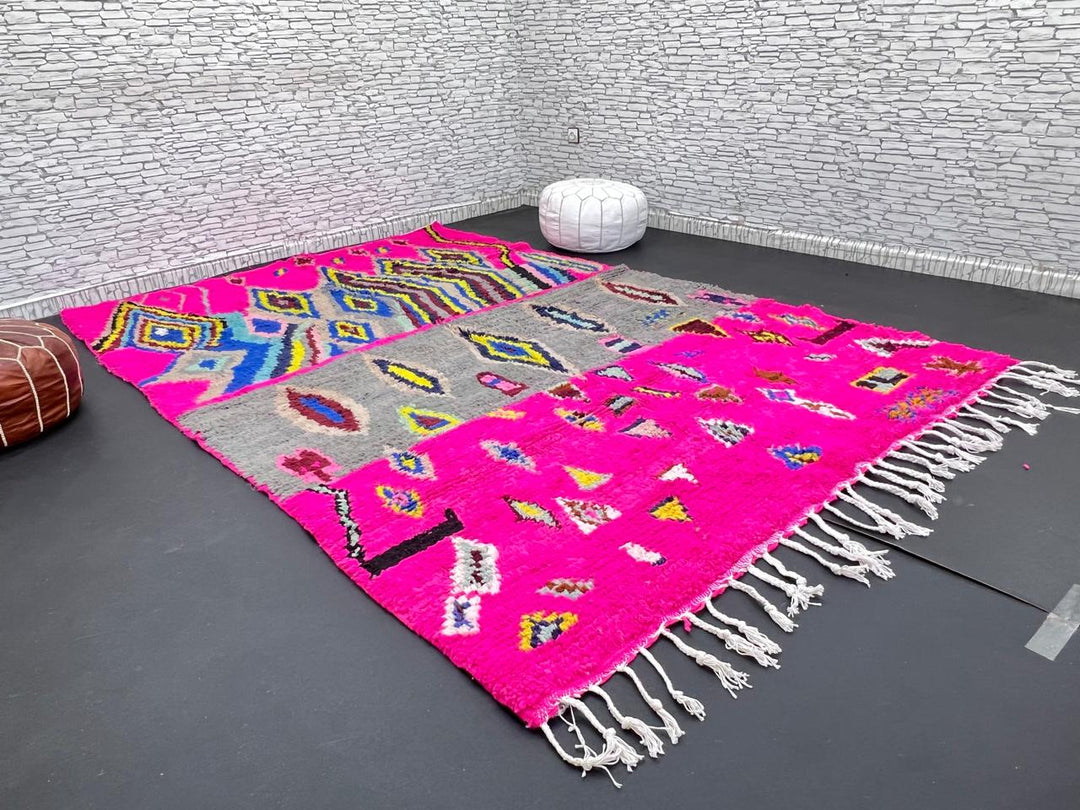 Vibrant pink Moroccan Berber rug with colorful tribal diamond patterns