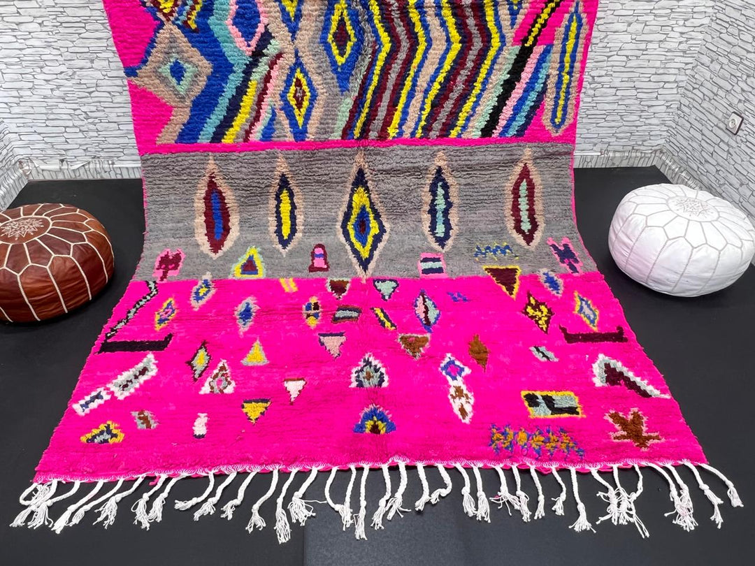Vibrant pink Moroccan Berber rug with colorful tribal diamond patterns