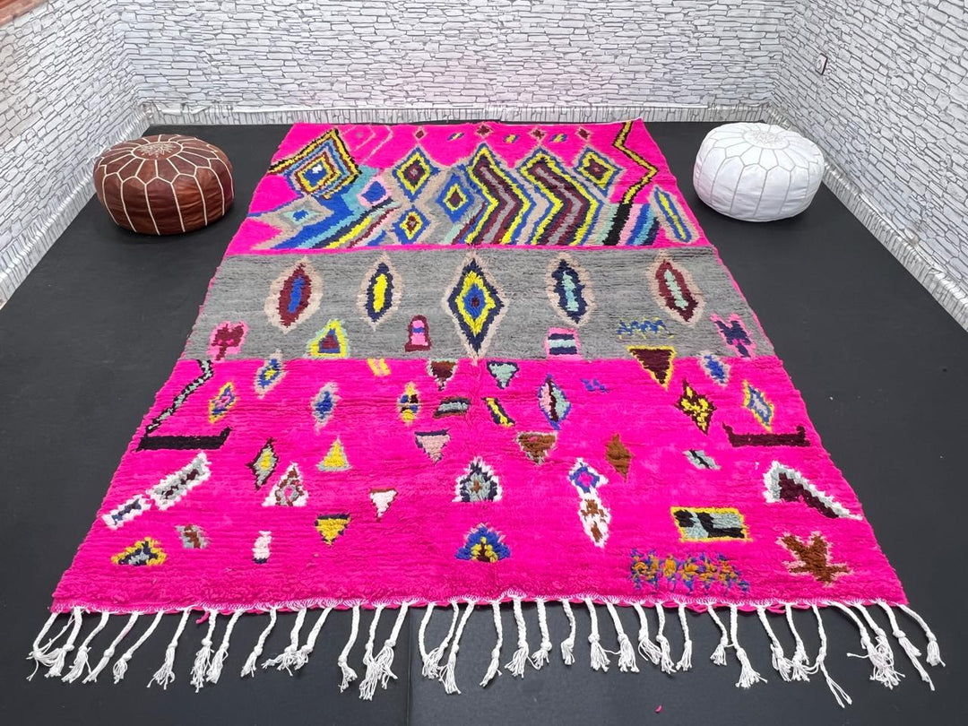 Vibrant pink Moroccan Berber rug with colorful tribal diamond patterns