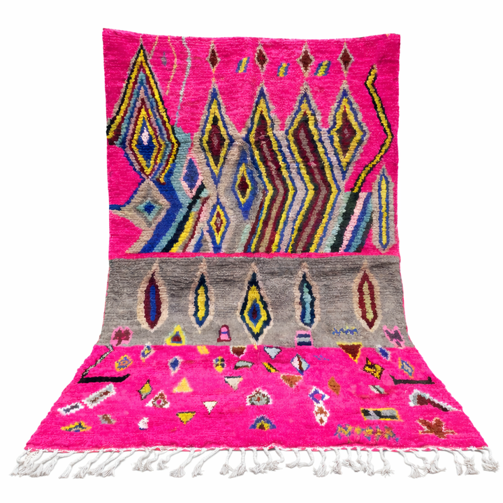 Vibrant pink Moroccan Berber rug with colorful tribal diamond patterns