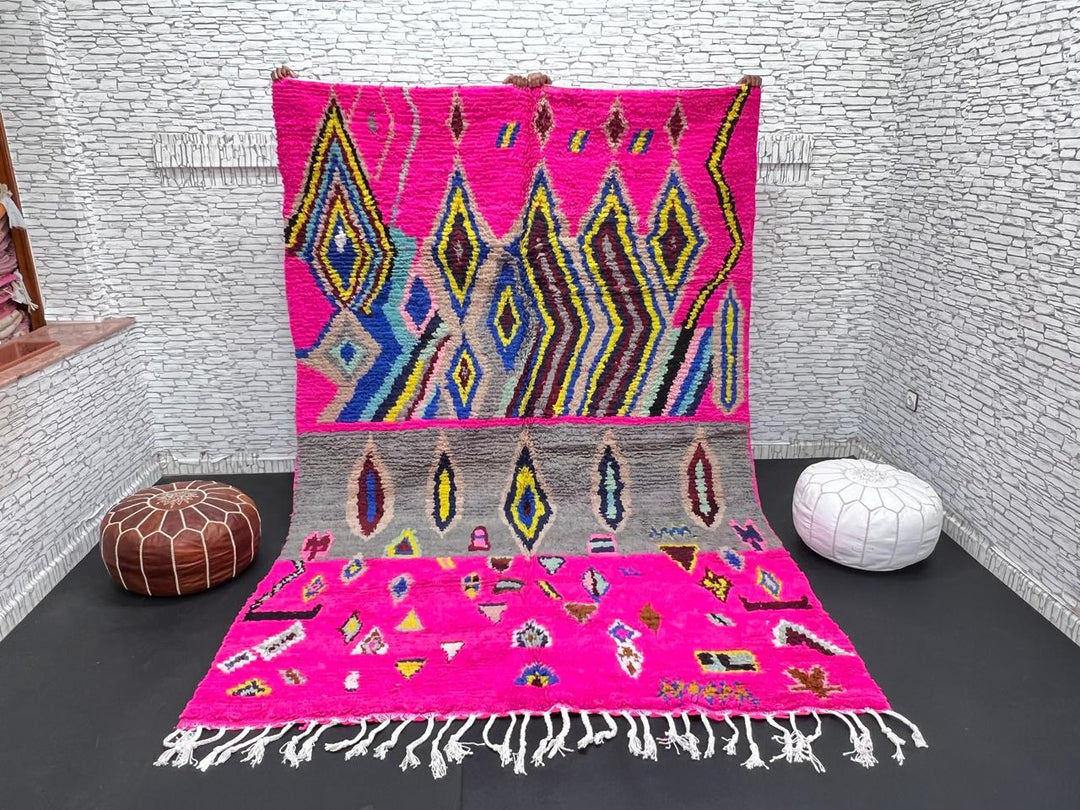 Vibrant pink Moroccan Berber rug with colorful tribal diamond patterns