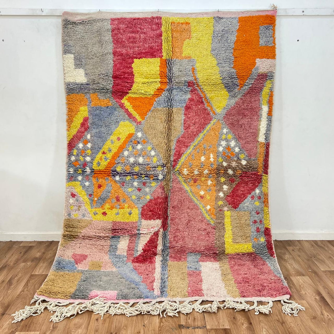 Vintage Moroccan wool rug with colorful abstract Berber geometric design in pink, yellow, grey and beige, handmade in Morocco, size 252x179 cm