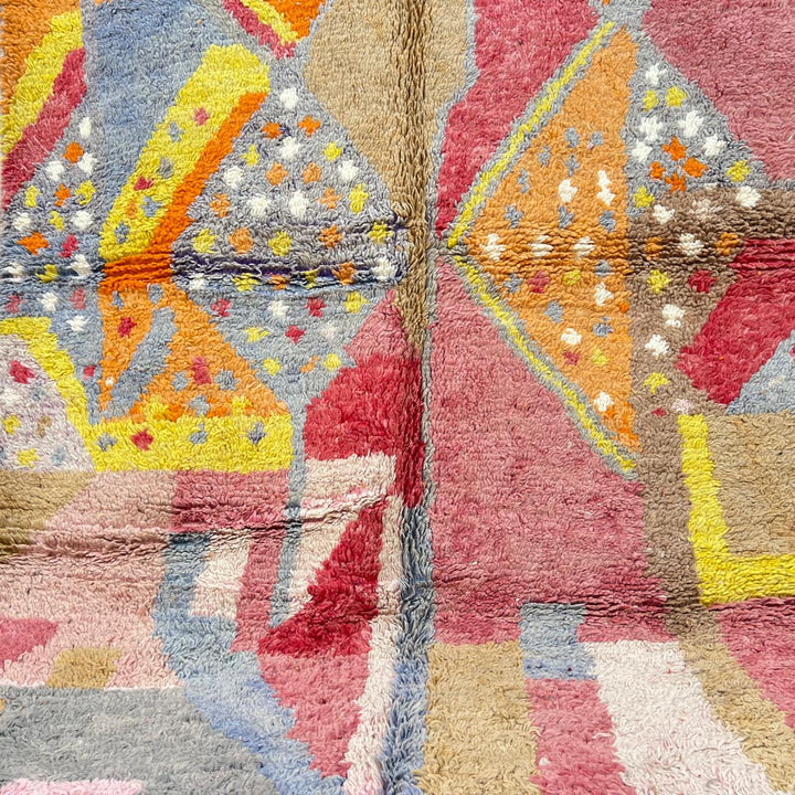 Vintage Moroccan wool rug with colorful abstract Berber geometric design in pink, yellow, grey and beige, handmade in Morocco, size 252x179 cm