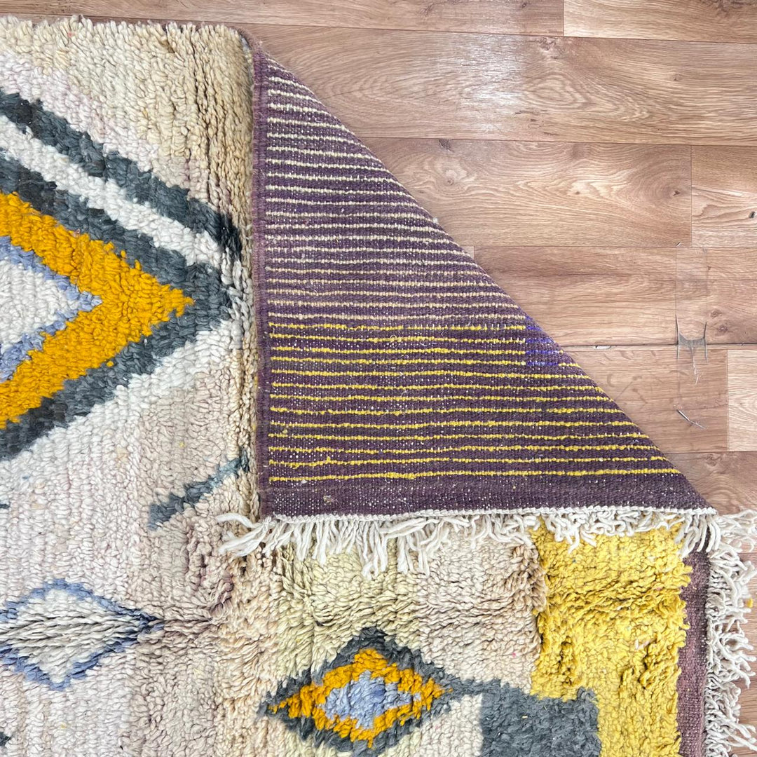 Vintage Moroccan Berber rug in mustard yellow with geometric tribal patterns, handmade wool area rug from Morocco