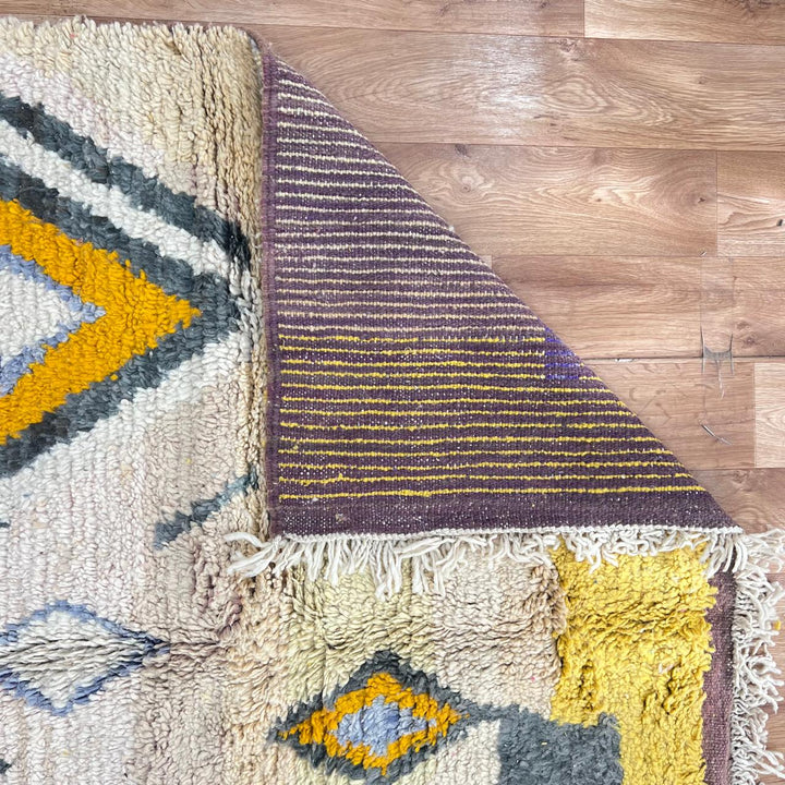 Vintage Moroccan Berber rug in mustard yellow with geometric tribal patterns, handmade wool area rug from Morocco