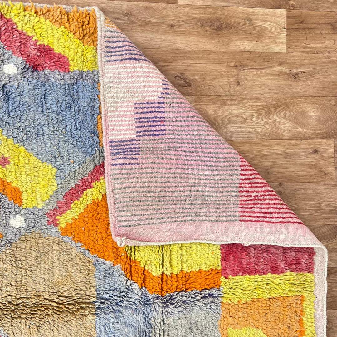 Vintage Moroccan wool rug with colorful abstract Berber geometric design in pink, yellow, grey and beige, handmade in Morocco, size 252x179 cm