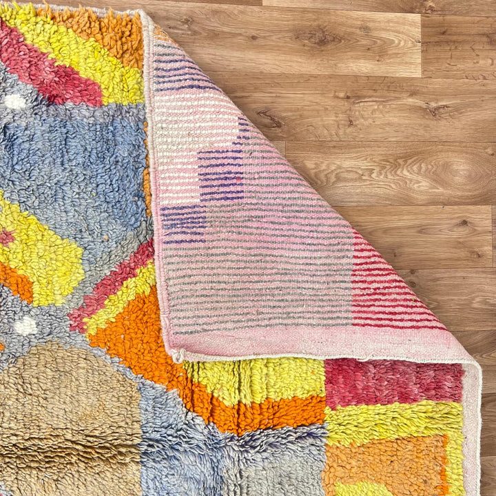 Vintage Moroccan wool rug with colorful abstract Berber geometric design in pink, yellow, grey and beige, handmade in Morocco, size 252x179 cm