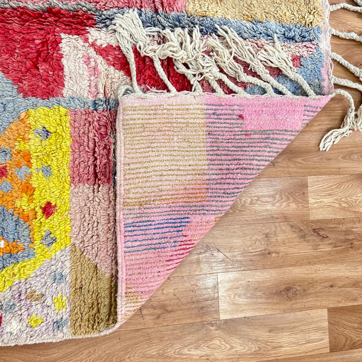Vintage Moroccan wool rug with colorful abstract Berber geometric design in pink, yellow, grey and beige, handmade in Morocco, size 252x179 cm
