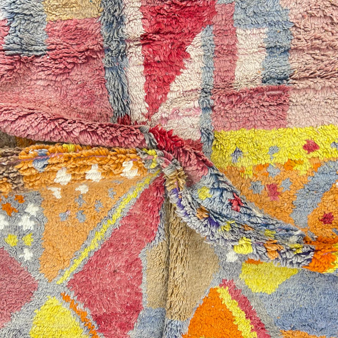 Vintage Moroccan wool rug with colorful abstract Berber geometric design in pink, yellow, grey and beige, handmade in Morocco, size 252x179 cm