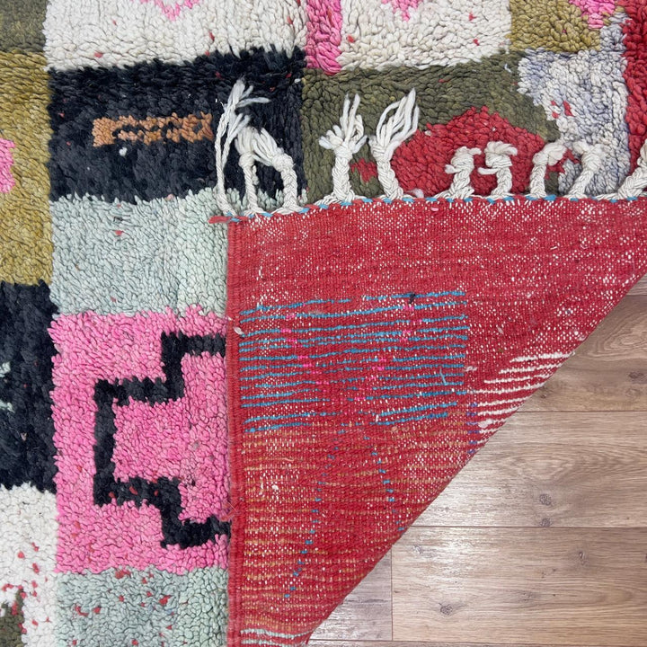 Handmade Moroccan Berber rug 95 with patchwork design in pink, mustard, and neutral tones, wool tribal carpet with geometric symbols