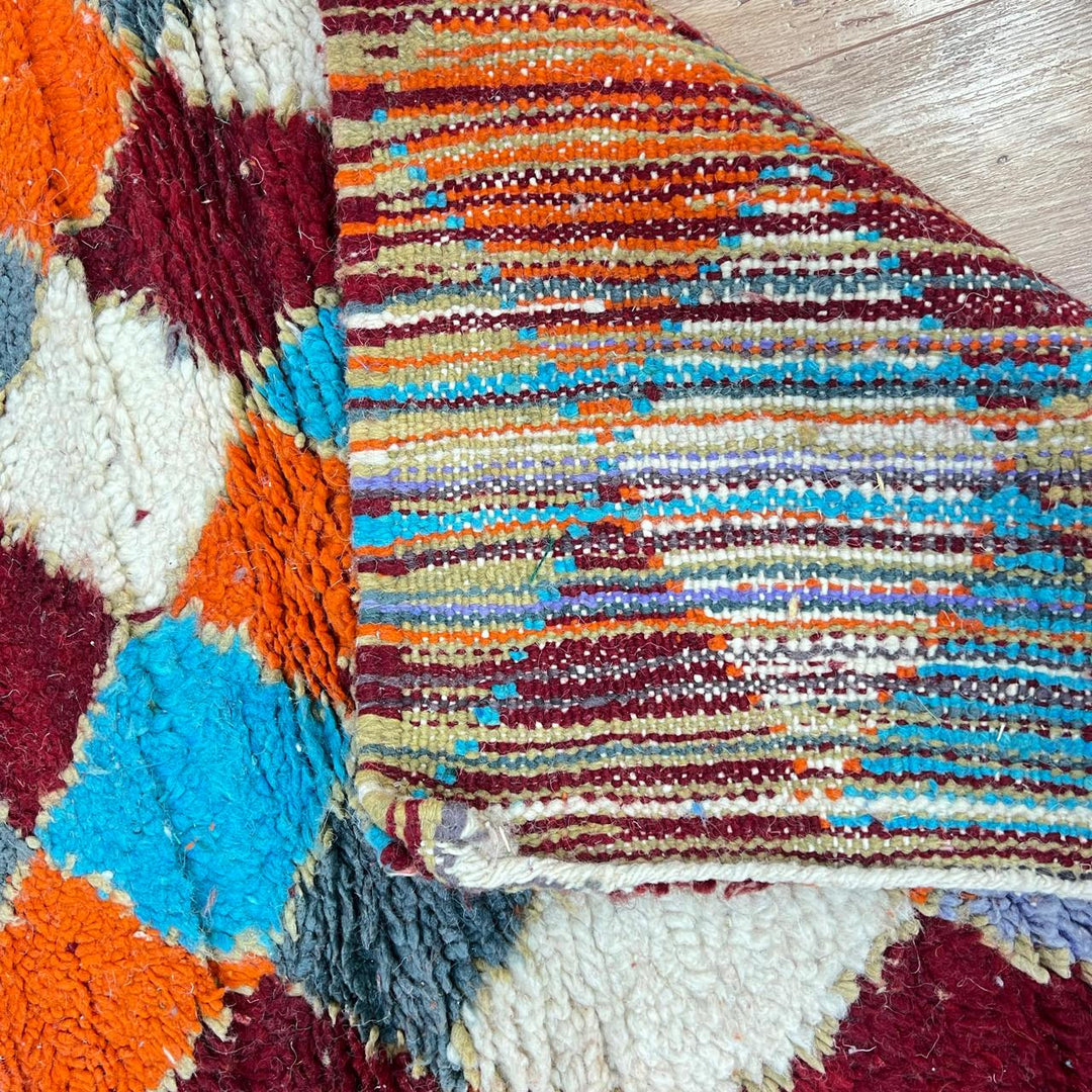 Vintage Moroccan wool runner rug 822 – handmade diamond-patterned Berber carpet in orange, turquoise, and red 407 × 83 cm (13.35 × 2.72 ft