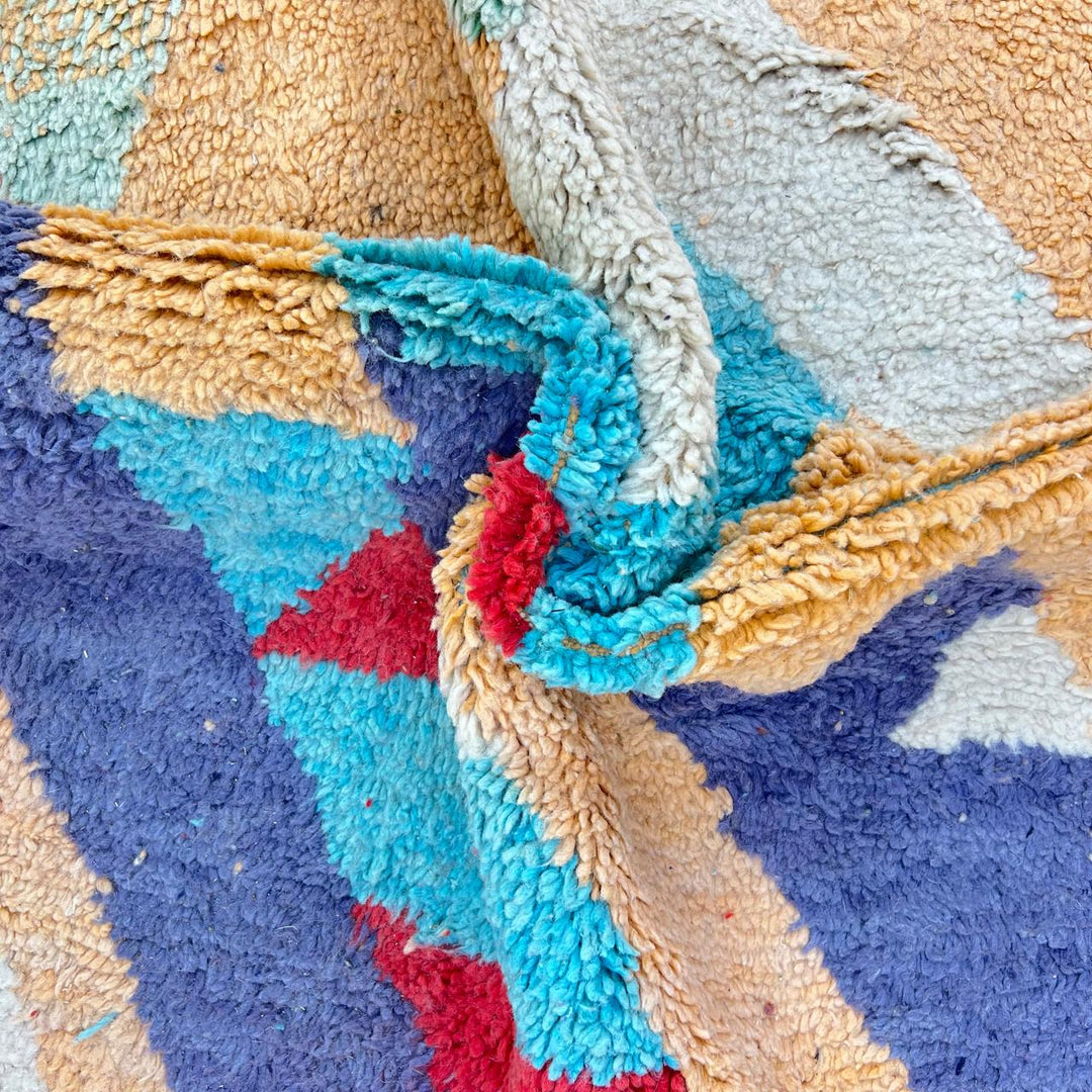 Vintage Moroccan wool rug 813 – handwoven Berber carpet featuring orange, red, turquoise and cream abstract patterns, 264 × 148 cm (8.66 × 4.85 ft).