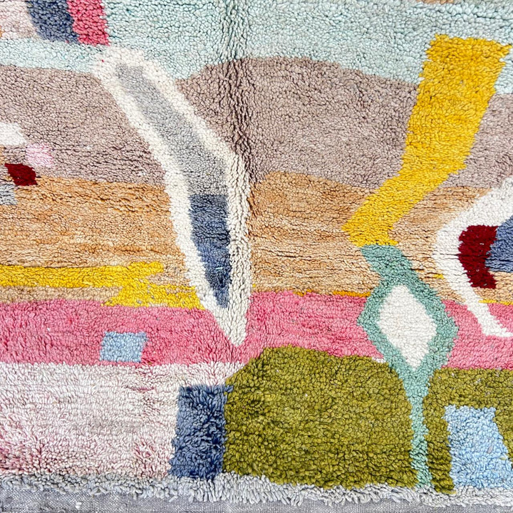 Vintage Moroccan wool rug 761 – handmade colorful Berber carpet with geometric abstract design in pink, turquoise, mustard, and beige tones, 260 × 151 cm.