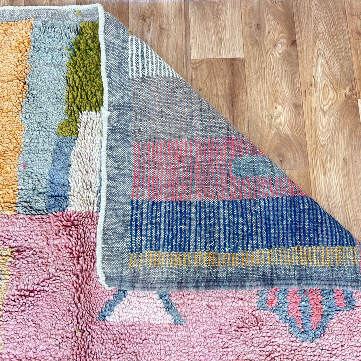 Vintage Moroccan wool rug 761 – handmade colorful Berber carpet with geometric abstract design in pink, turquoise, mustard, and beige tones, 260 × 151 cm.