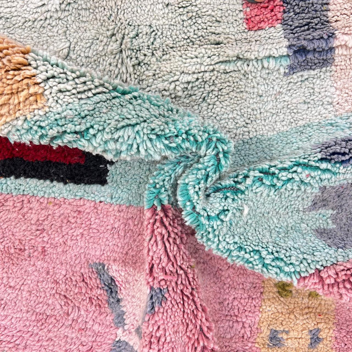 Vintage Moroccan wool rug 761 – handmade colorful Berber carpet with geometric abstract design in pink, turquoise, mustard, and beige tones, 260 × 151 cm.