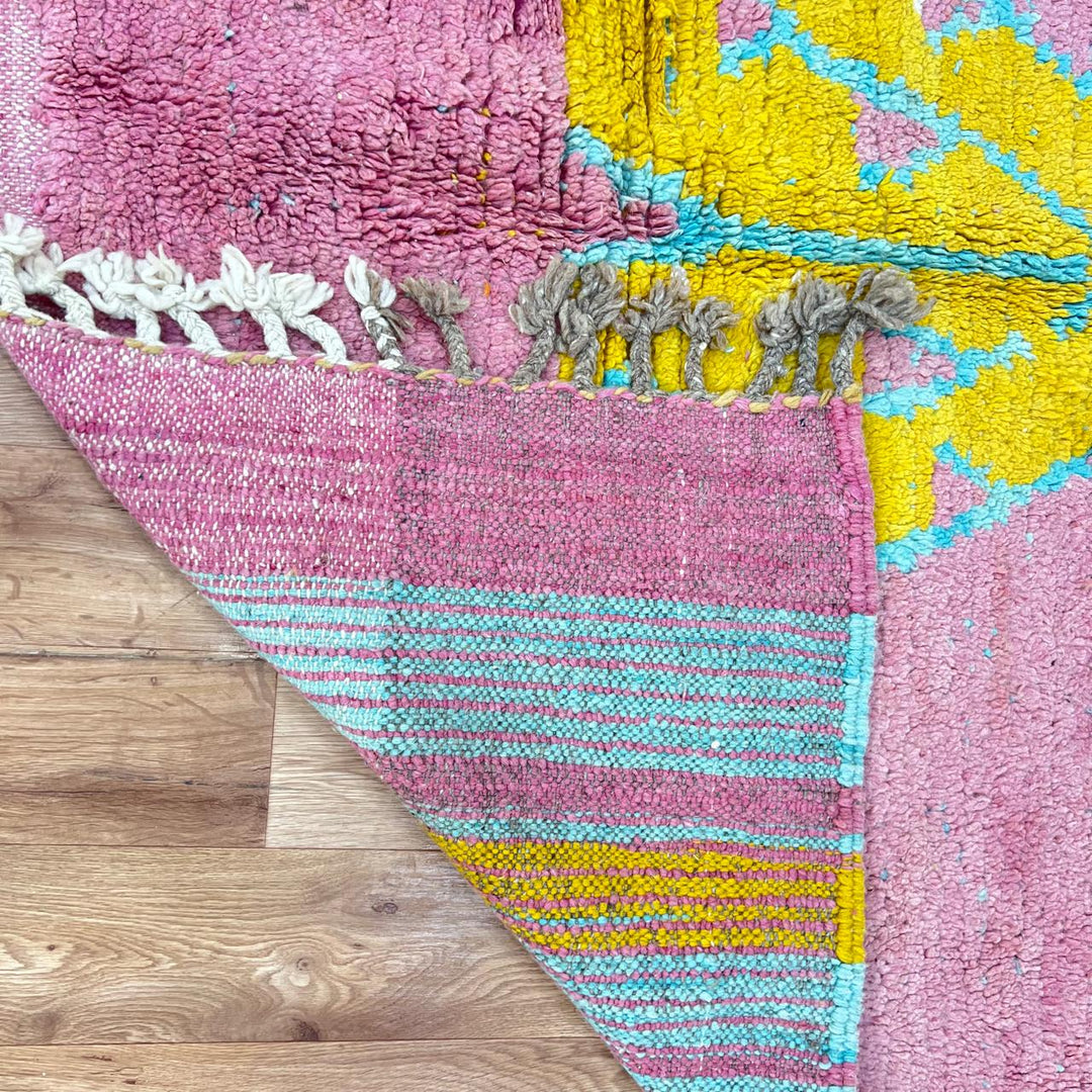 Vintage Moroccan wool rug 779 – handmade pink and yellow geometric Berber carpet with turquoise details, 325 × 167 cm (10.66 × 5.47 ft).