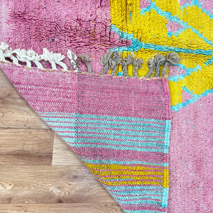 Vintage Moroccan wool rug 779 – handmade pink and yellow geometric Berber carpet with turquoise details, 325 × 167 cm (10.66 × 5.47 ft).