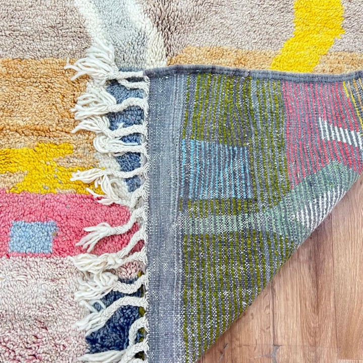 Vintage Moroccan wool rug 761 – handmade colorful Berber carpet with geometric abstract design in pink, turquoise, mustard, and beige tones, 260 × 151 cm.