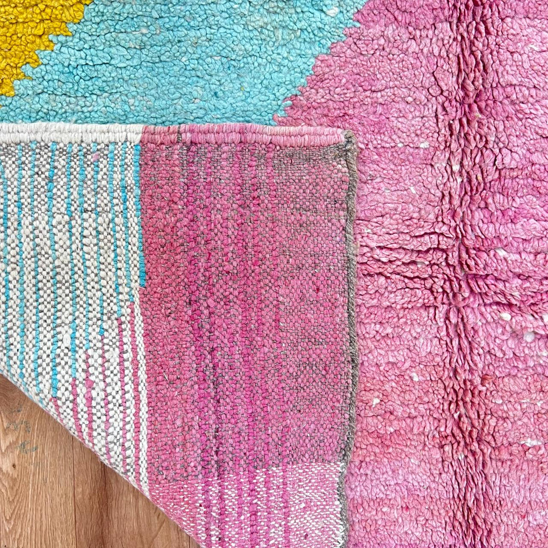 Vintage Moroccan wool rug 779 – handmade pink and yellow geometric Berber carpet with turquoise details, 325 × 167 cm (10.66 × 5.47 ft).