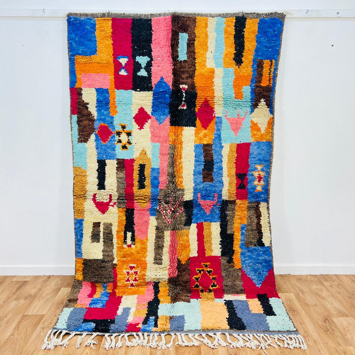 Vintage Moroccan rug handmade from colorful Berber wool with bold patchwork geometric design, 250x150 cm
