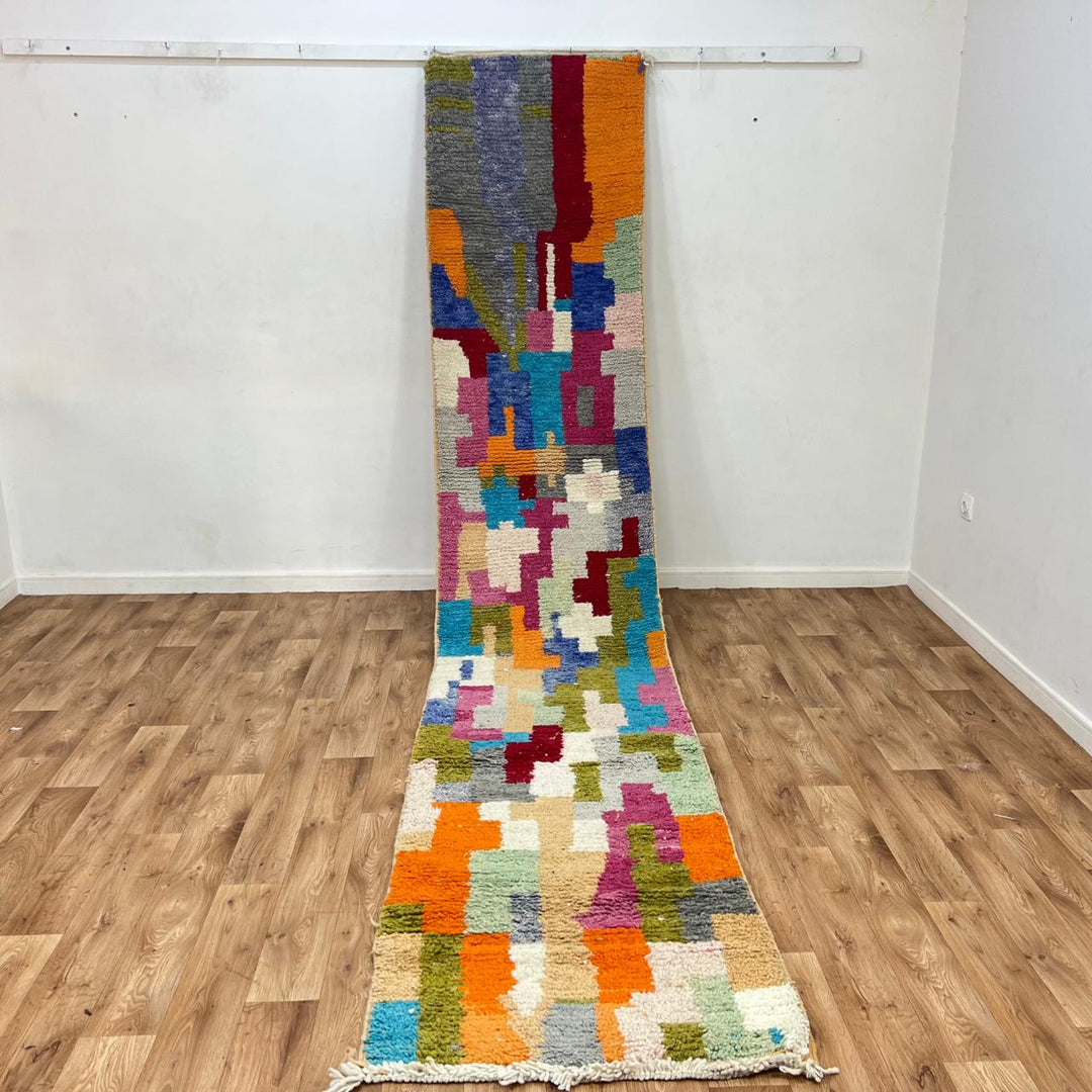 Vintage Moroccan wool runner 814 – handmade colorful Berber rug with abstract patchwork pattern in orange, pink, blue, and green, 409 × 80 cm (13.42 × 2.62 ft).