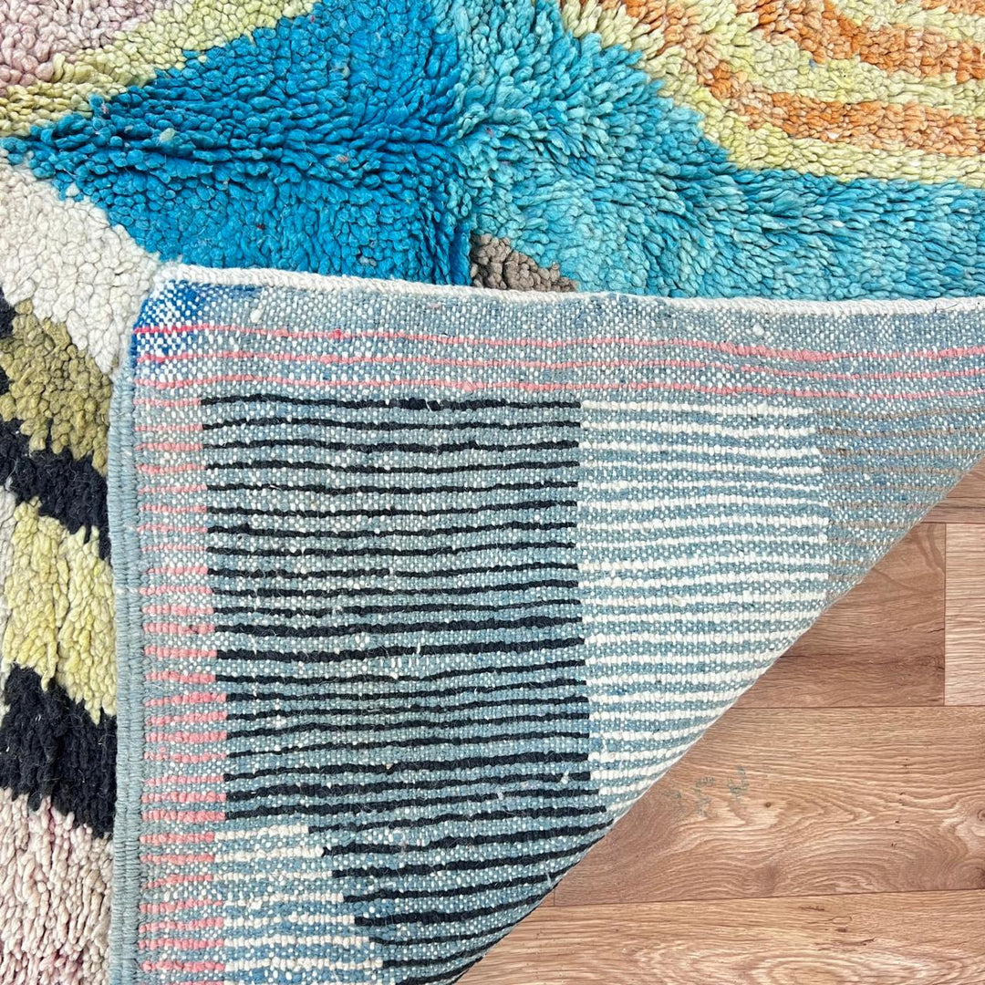 Vintage Moroccan wool rug 738 – handmade colorful geometric Berber carpet in turquoise, pink, yellow, and black 248 × 153 cm (8.13 × 5.02 ft).