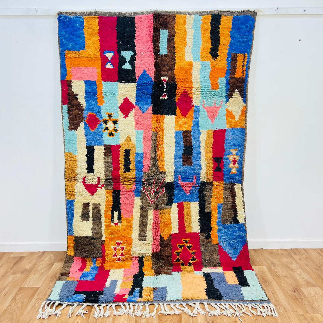 Vintage Moroccan rug handmade from colorful Berber wool with bold patchwork geometric design, 250x150 cm
