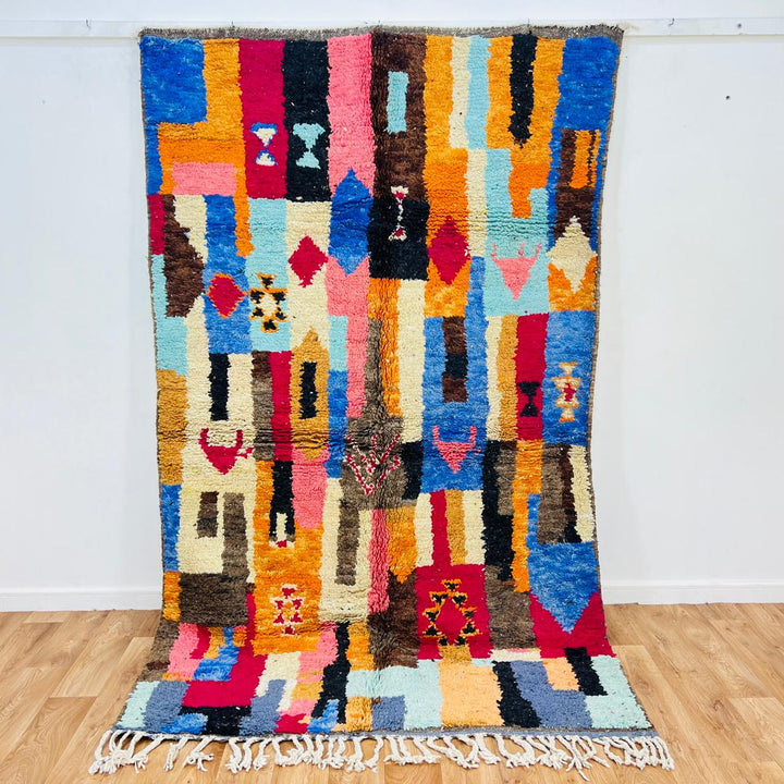 Vintage Moroccan rug handmade from colorful Berber wool with bold patchwork geometric design, 250x150 cm