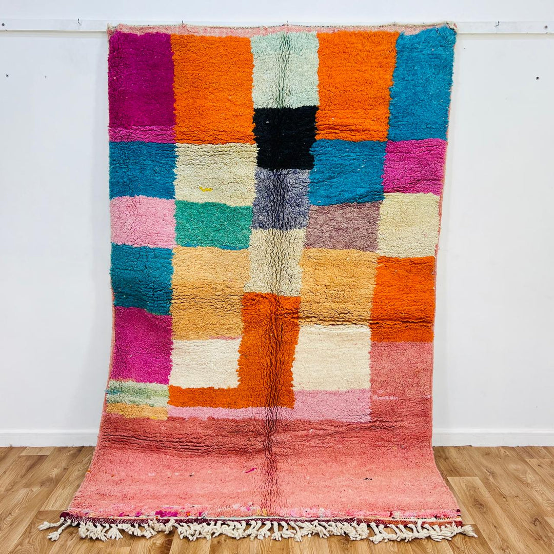 Vintage Moroccan patchwork rug handmade from natural wool with colorful Berber squares