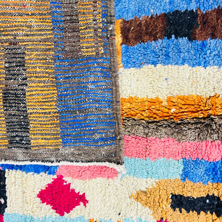 Vintage Moroccan rug handmade from colorful Berber wool with bold patchwork geometric design, 250x150 cm