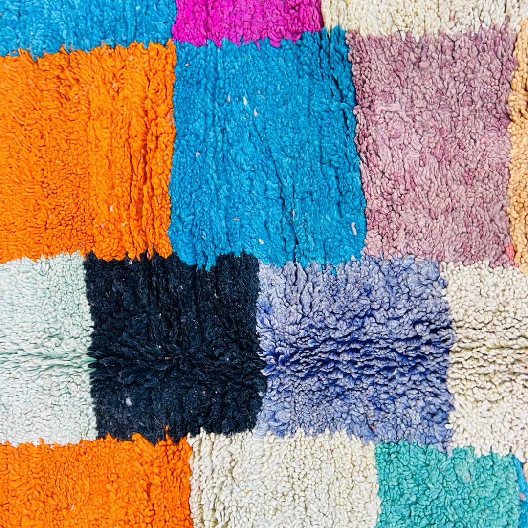 Vintage Moroccan patchwork rug handmade from natural wool with colorful Berber squares