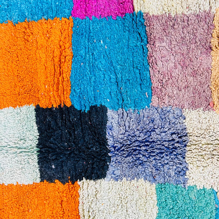 Vintage Moroccan patchwork rug handmade from natural wool with colorful Berber squares