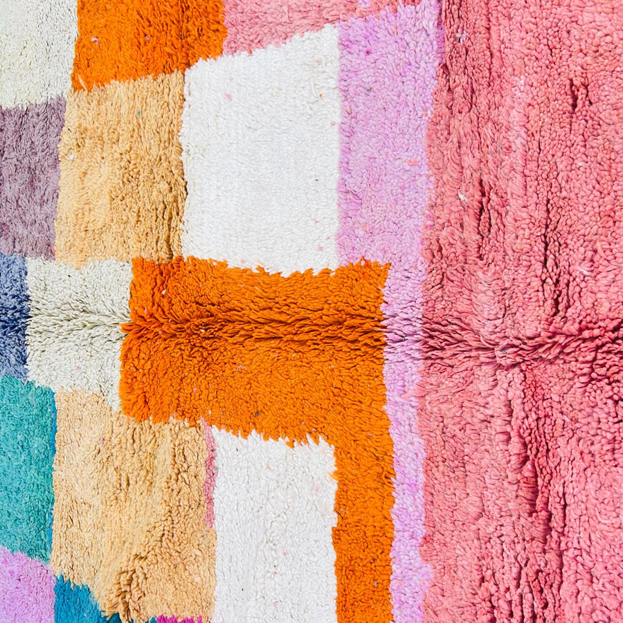 Vintage Moroccan patchwork rug handmade from natural wool with colorful Berber squares