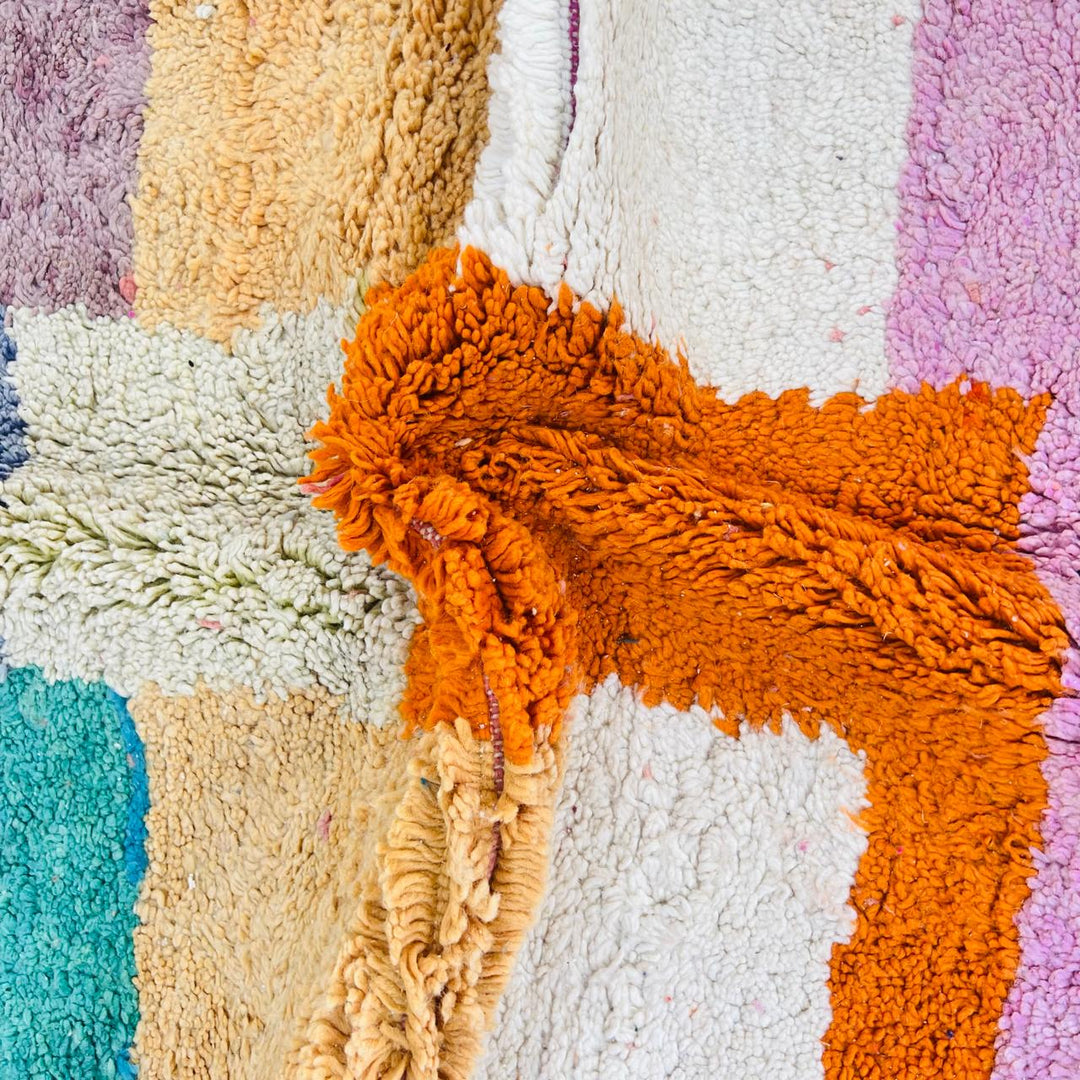 Vintage Moroccan patchwork rug handmade from natural wool with colorful Berber squares