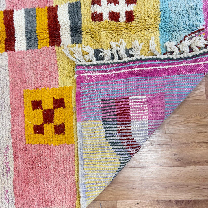 Vintage Moroccan wool rug with neutral base and colorful Berber geometric patterns