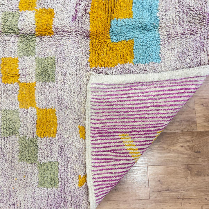 Vintage Moroccan wool rug with neutral base and colorful Berber geometric patterns