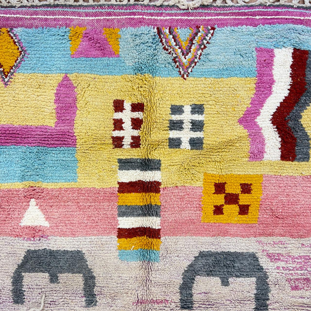 Vintage Moroccan wool rug with neutral base and colorful Berber geometric patterns