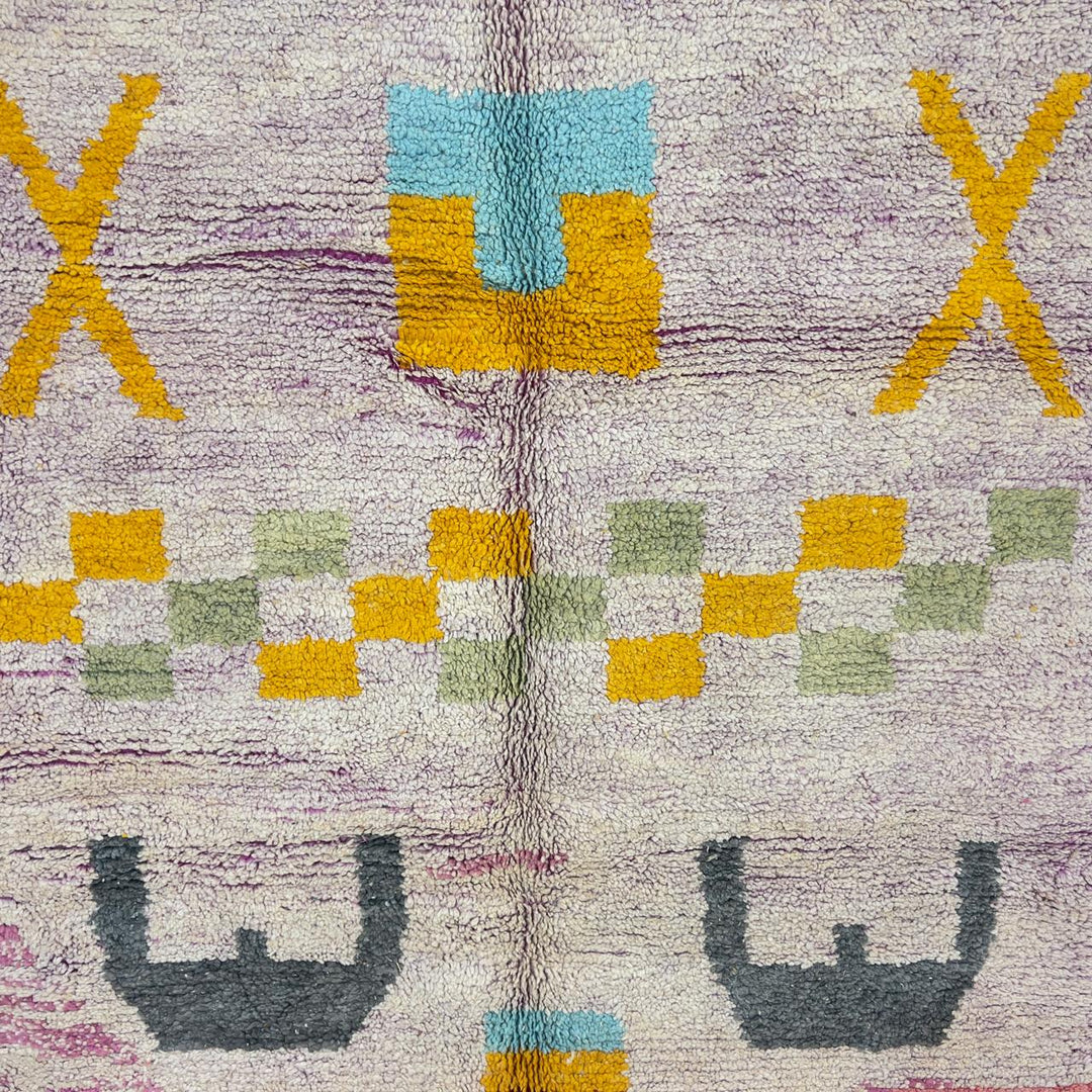 Vintage Moroccan wool rug with neutral base and colorful Berber geometric patterns