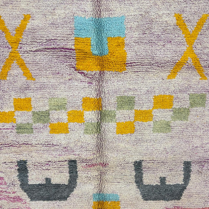 Vintage Moroccan wool rug with neutral base and colorful Berber geometric patterns