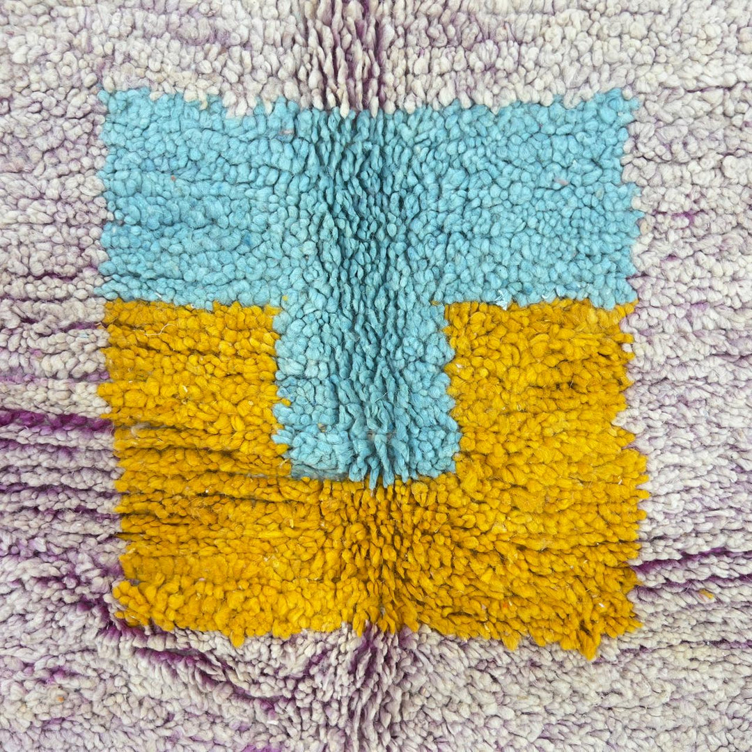 Vintage Moroccan wool rug with neutral base and colorful Berber geometric patterns