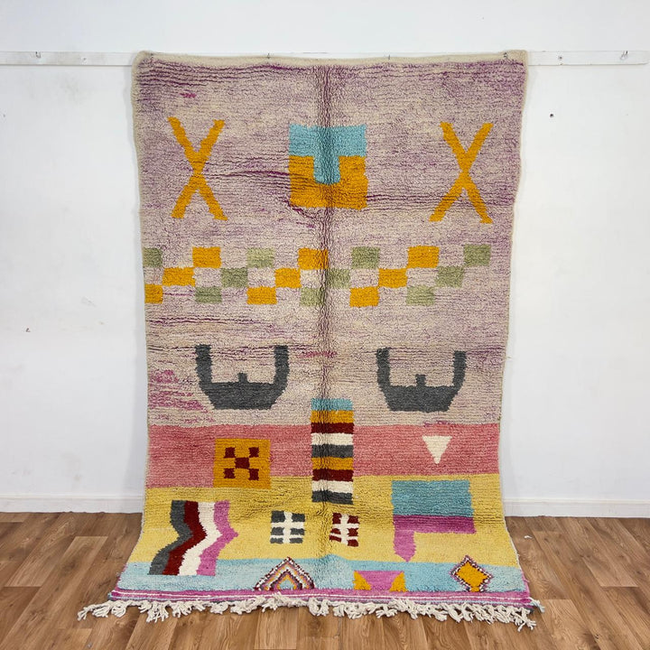 Vintage Moroccan wool rug with neutral base and colorful Berber geometric patterns