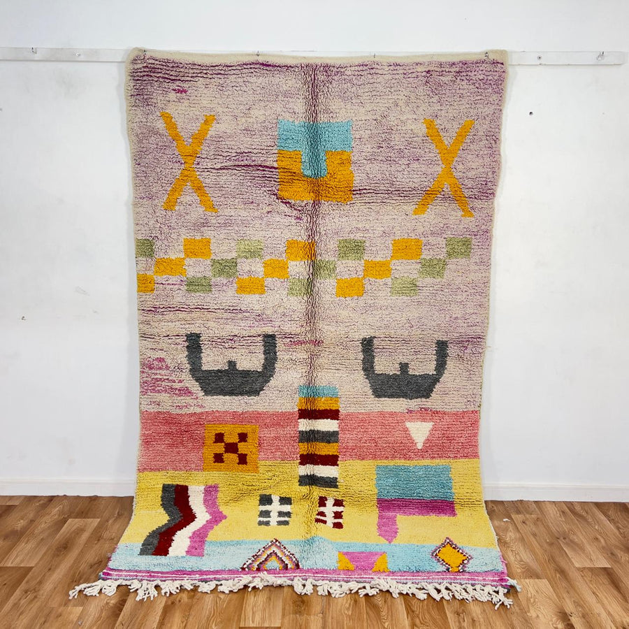 Vintage Moroccan wool rug with neutral base and colorful Berber geometric patterns