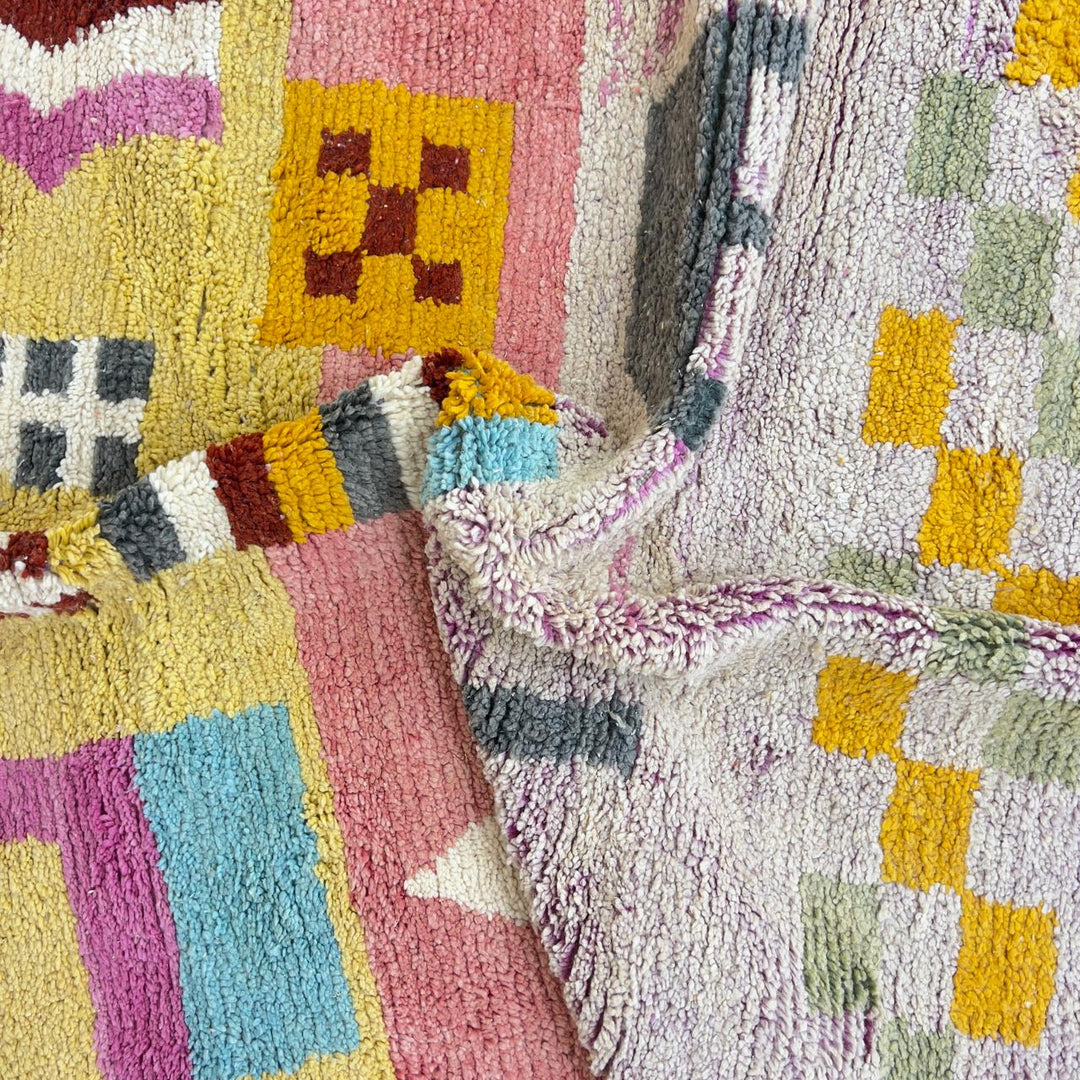 Vintage Moroccan wool rug with neutral base and colorful Berber geometric patterns
