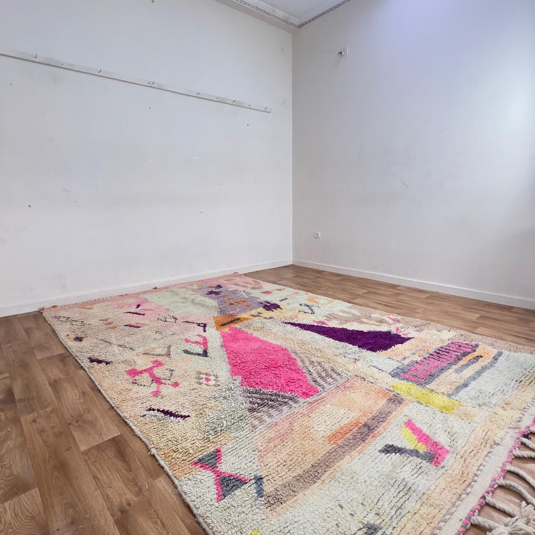 Large vintage Moroccan wool rug with abstract tribal symbols in beige, pink, and purple handmade Berber carpet