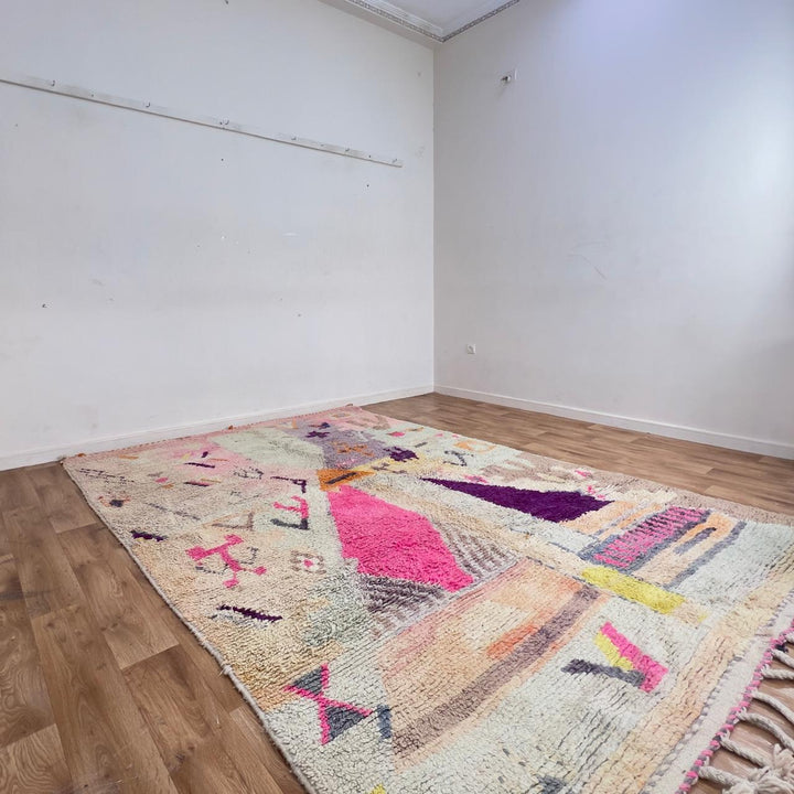 Large vintage Moroccan wool rug with abstract tribal symbols in beige, pink, and purple handmade Berber carpet