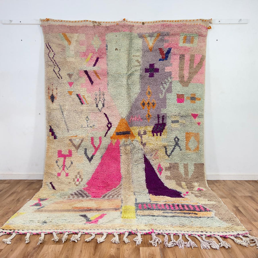 Large vintage Moroccan wool rug with abstract tribal symbols in beige, pink, and purple handmade Berber carpet