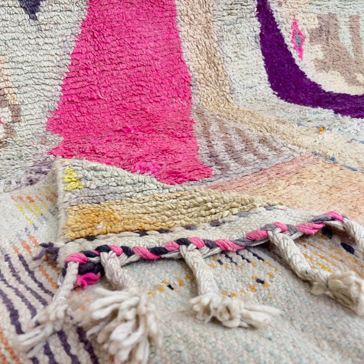 Large vintage Moroccan wool rug with abstract tribal symbols in beige, pink, and purple handmade Berber carpet